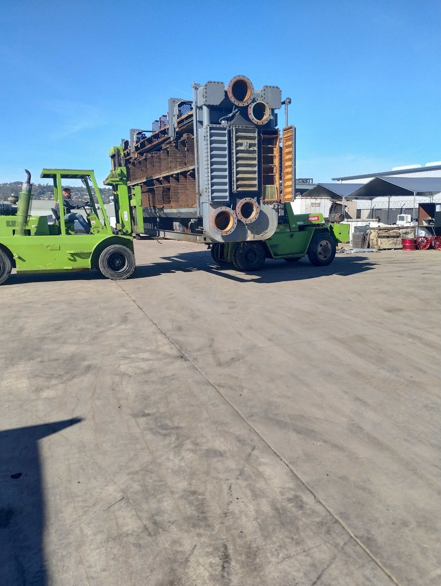 Demolition scrap being handled by forklift at the C4S Recycling facility